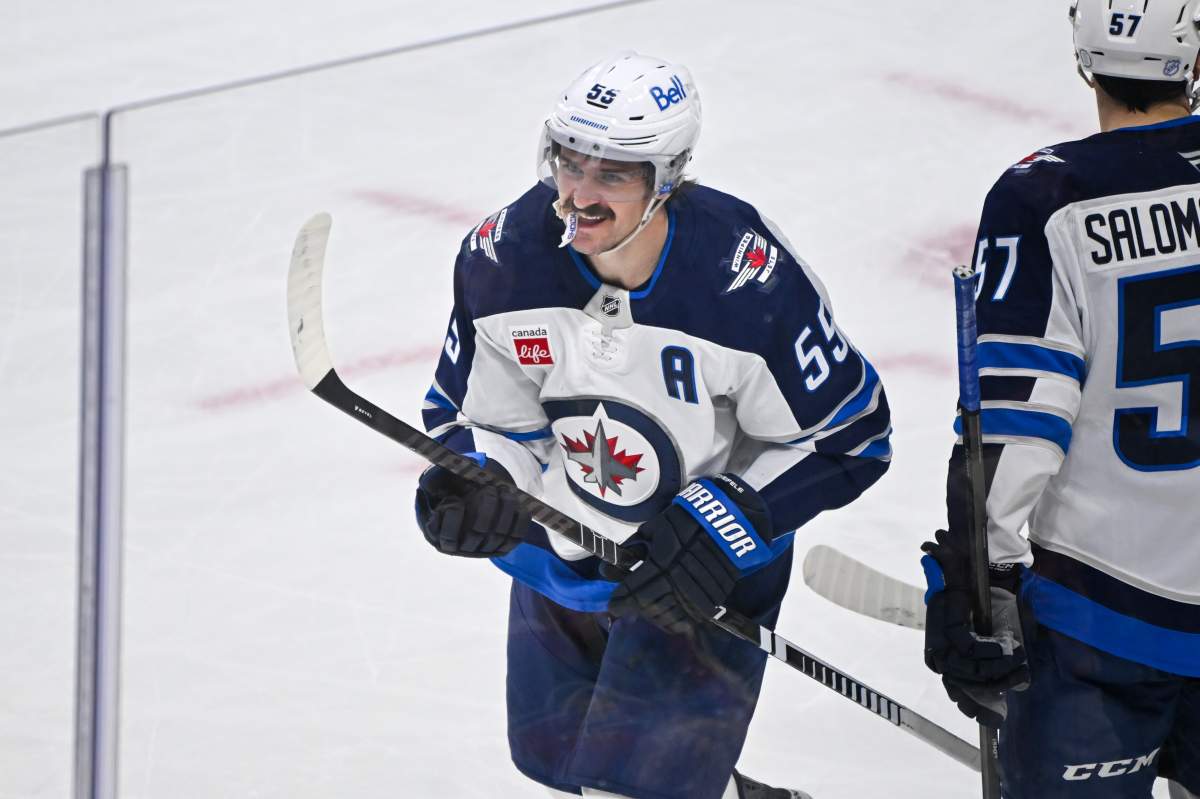 Winnipeg Jets center Mark Scheifele (55) celebrates after scoring a goal against the Minnesota Wild during the second period of an NHL hockey game Thursday, Jan. 15, 2025, in St. Paul, Minn. (AP Photo/Craig Lassig).
