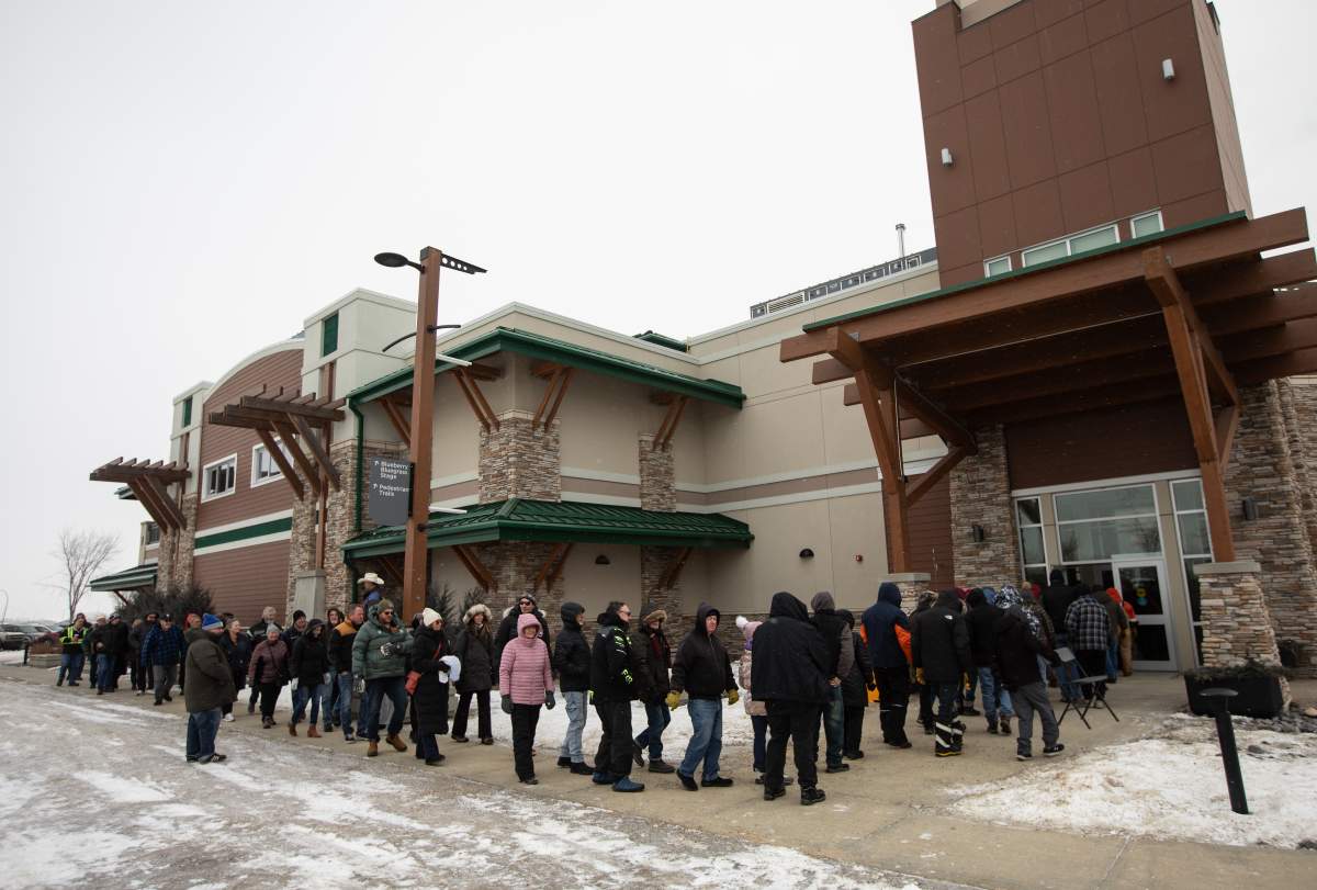 People line up to sign a petition that seeks to have a referendum on Alberta separation, in Stony Plain, Alta., Thursday, Jan. 22, 2026.