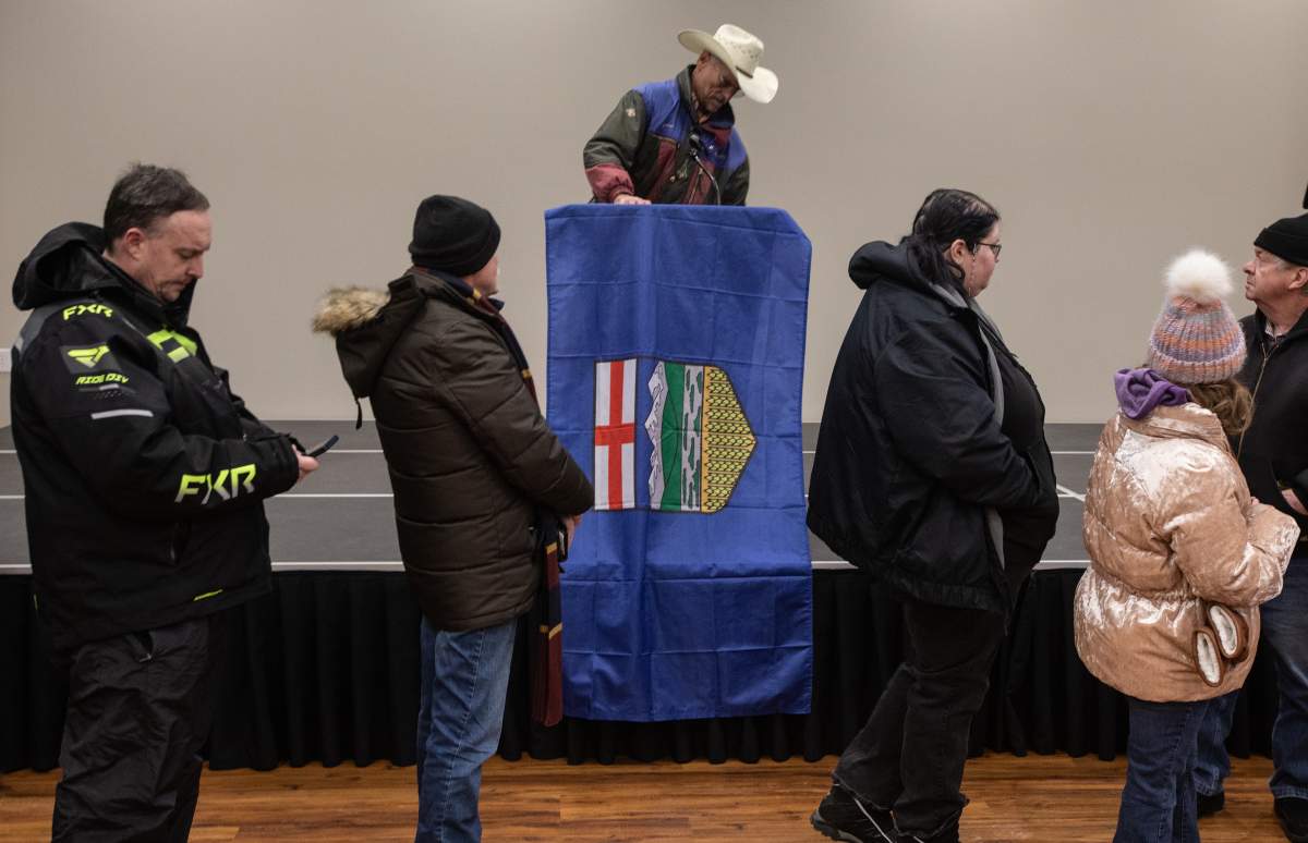 People line up to sign a petition that seeks to have a referendum on Alberta separation, in Stony Plain, Alta., Thursday, Jan. 22, 2026.