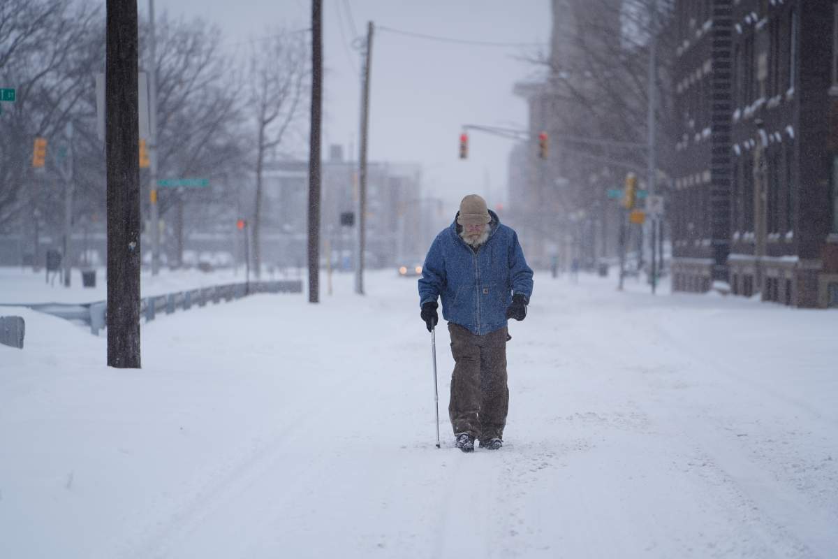 Person walks outside during snowstorm