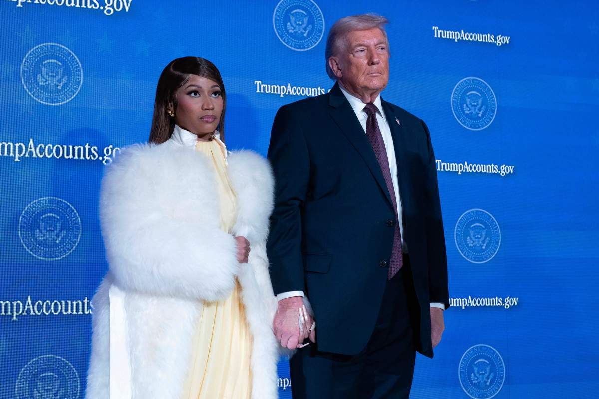 Nicki Minaj and President Donald Trump stand on stage during the launch of a program known as Trump Accounts at the Andrew W. Mellon Auditorium, Wednesday, Jan. 28, 2026, in Washington.