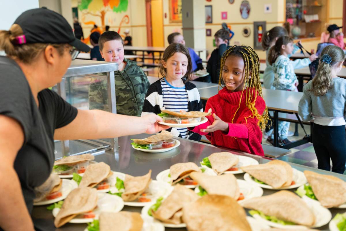 A student picks up her lunch at a Glace Bay, N.S. elementary school in 2024.