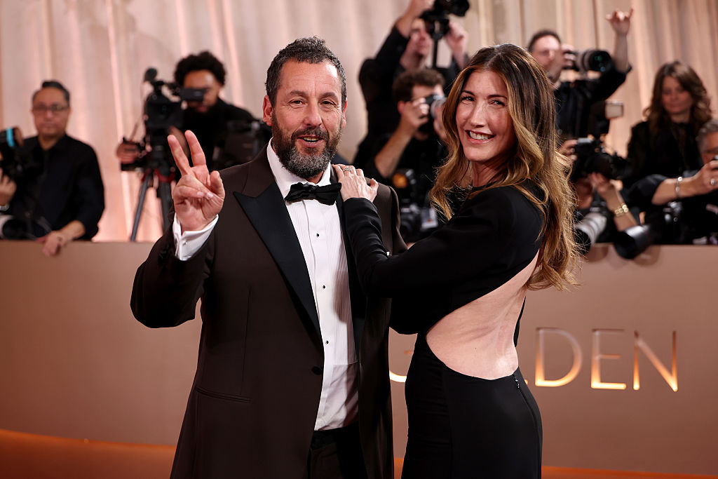 Adam Sandler and Jackie Sandler attend the 83rd annual Golden Globe Awards.