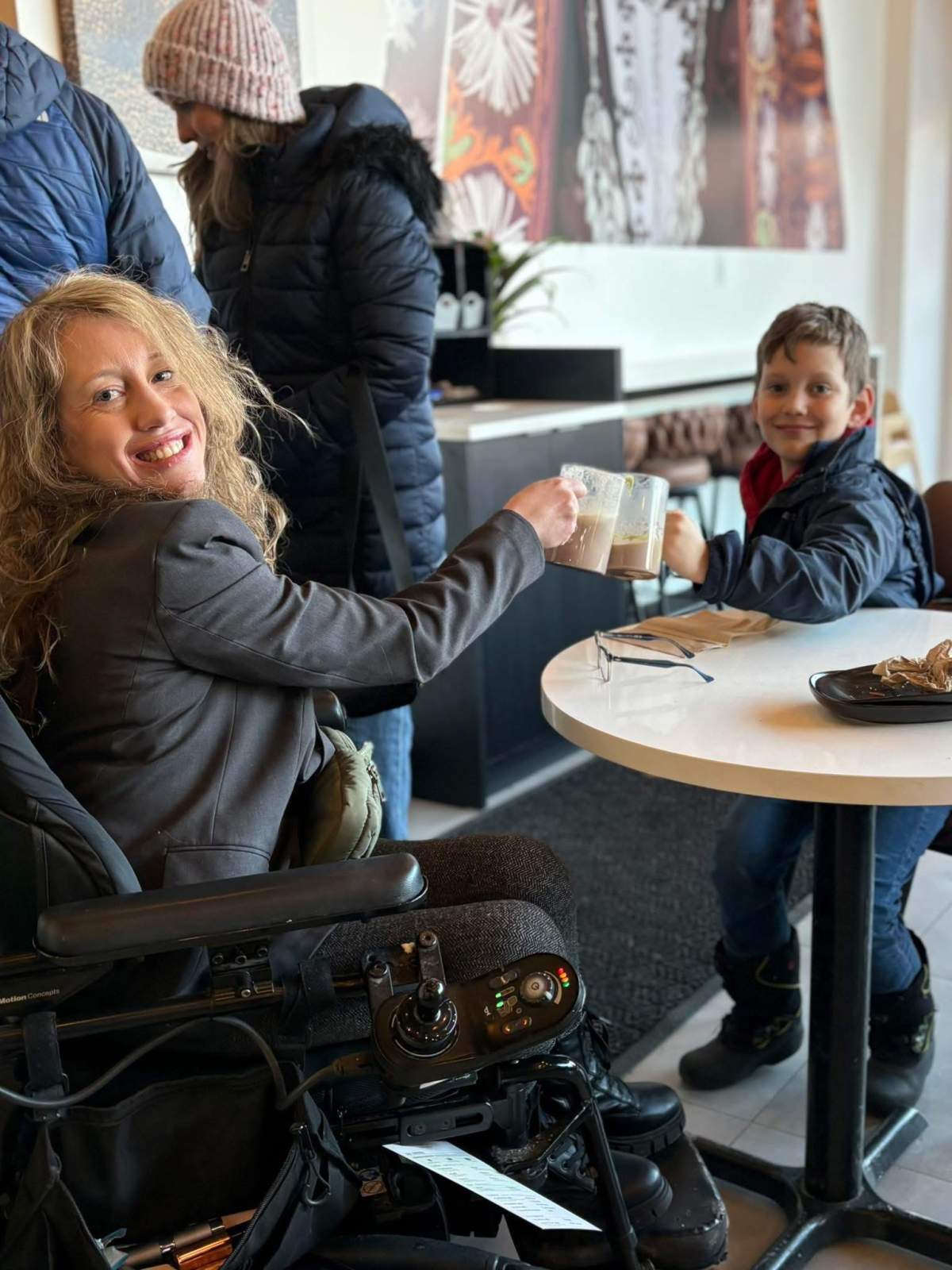 Jocelyn Dennis enjoys a drink with her young son.