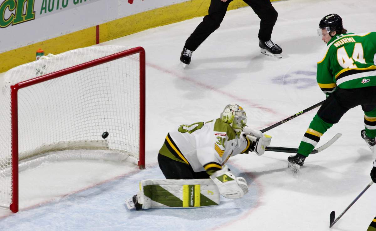 Jesse Nurmi of the London Knights scores on North Bay Battalion goaltender Jake Lisson in a game played at Canada Life Place on Jan. 30, 2026.