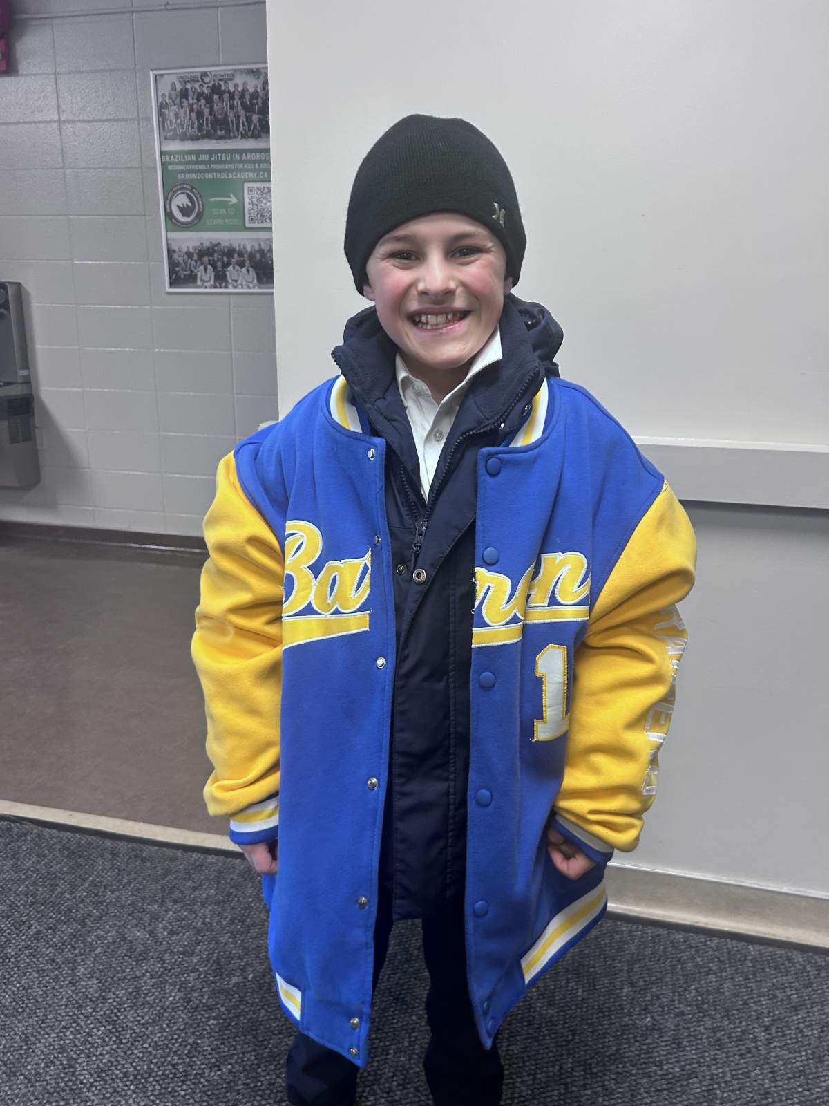 Dante Timleck wears his hockey team's MVP jacket after his first game in almost three months.