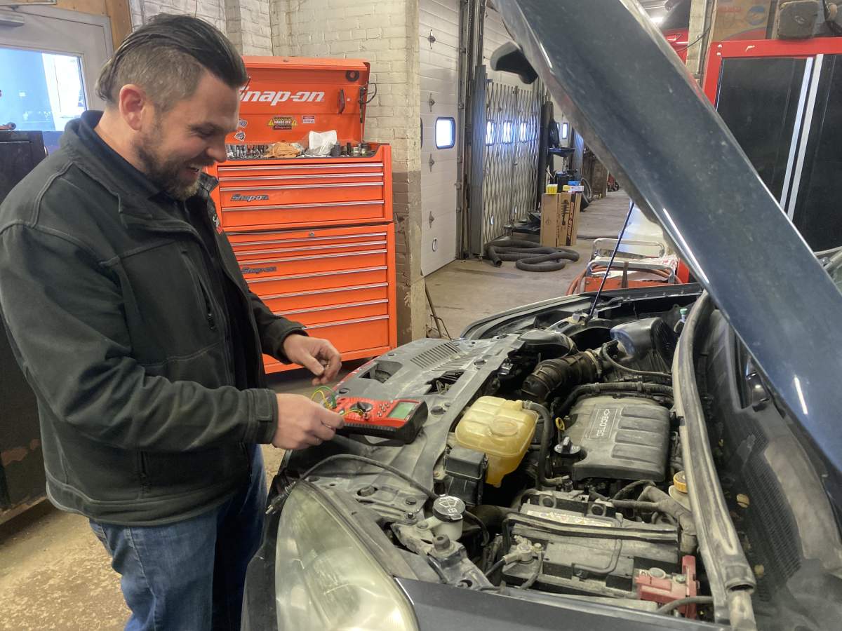 Simcoe Motors Owner Andrew Sirett at his Notre Dame Ave. auto shop
