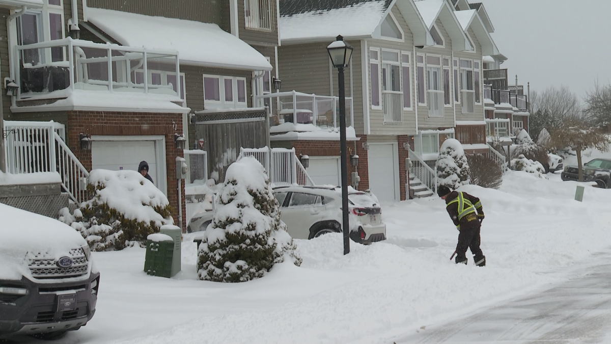 A Saint John, N.B. resident shovels snow on Jan. 26, 2026.