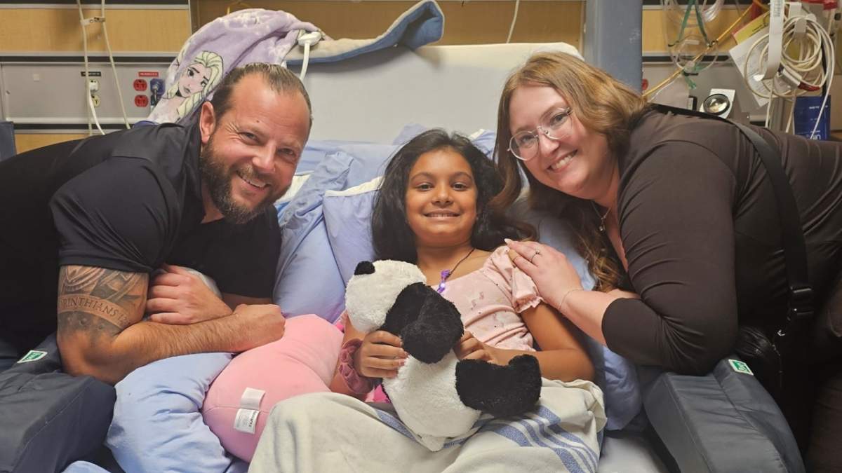 Chloe Aranha in hospital, being visited by Eric Motut and Ainsley Dillion after they saved her life at school on Oct. 3, 2025.