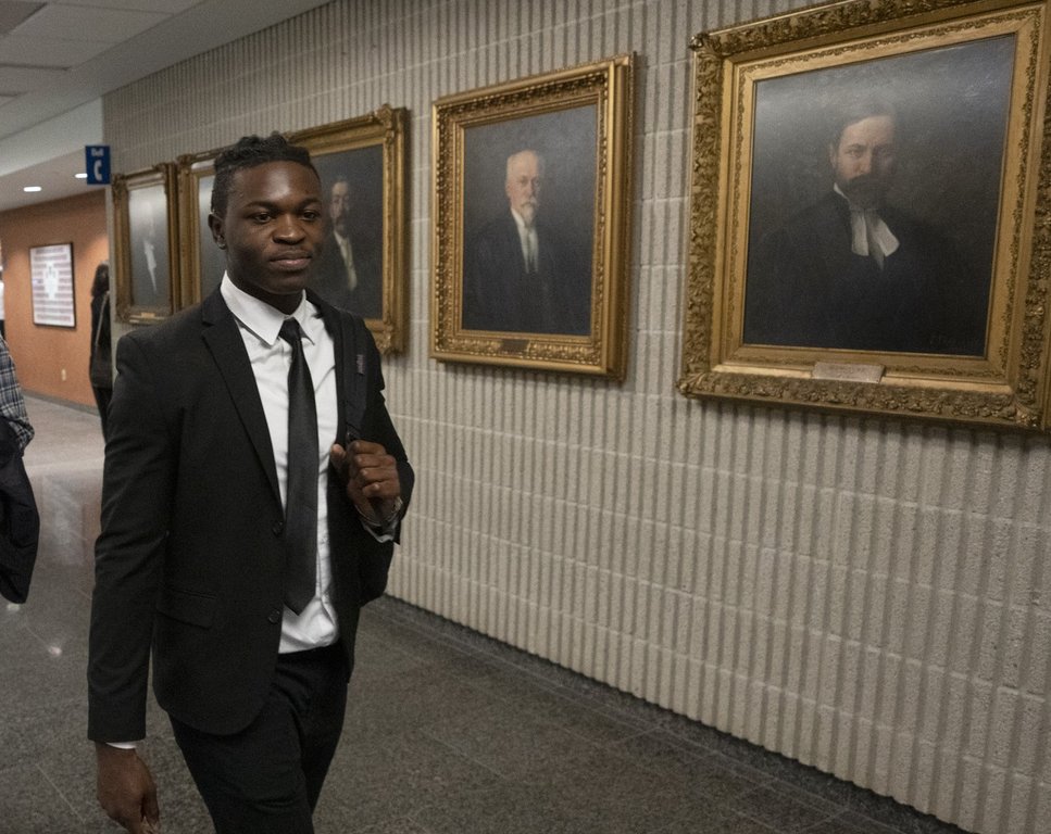 Joseph-Christopher Luamba arrives for his court challenge Monday, May 30, 2022  in Montreal. Luamba is suing the government over alleged police racial profiling.