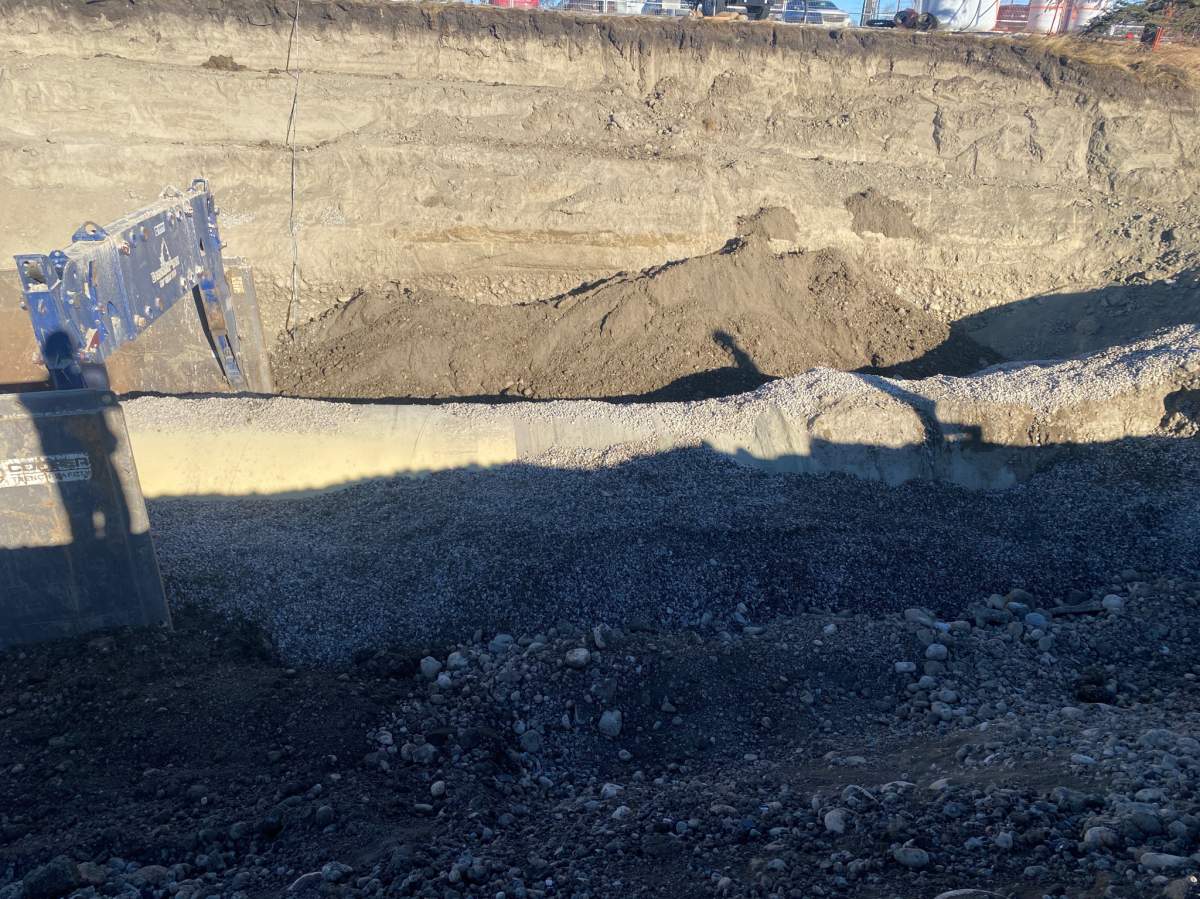 Photos provided by the city of Calgary show crews have now begun the process of backfilling the large excavation around the repaired section of the Bearspaw Water Main.