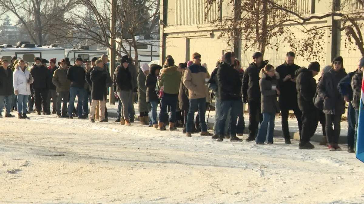 A long line of people outside an Alberta independence petition signing event in Calgary on Jan. 26, 2026.