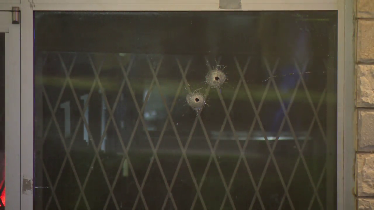 Bullet holes can be seen in the window of Bhojan Sweets and Restaurant in Surrey.