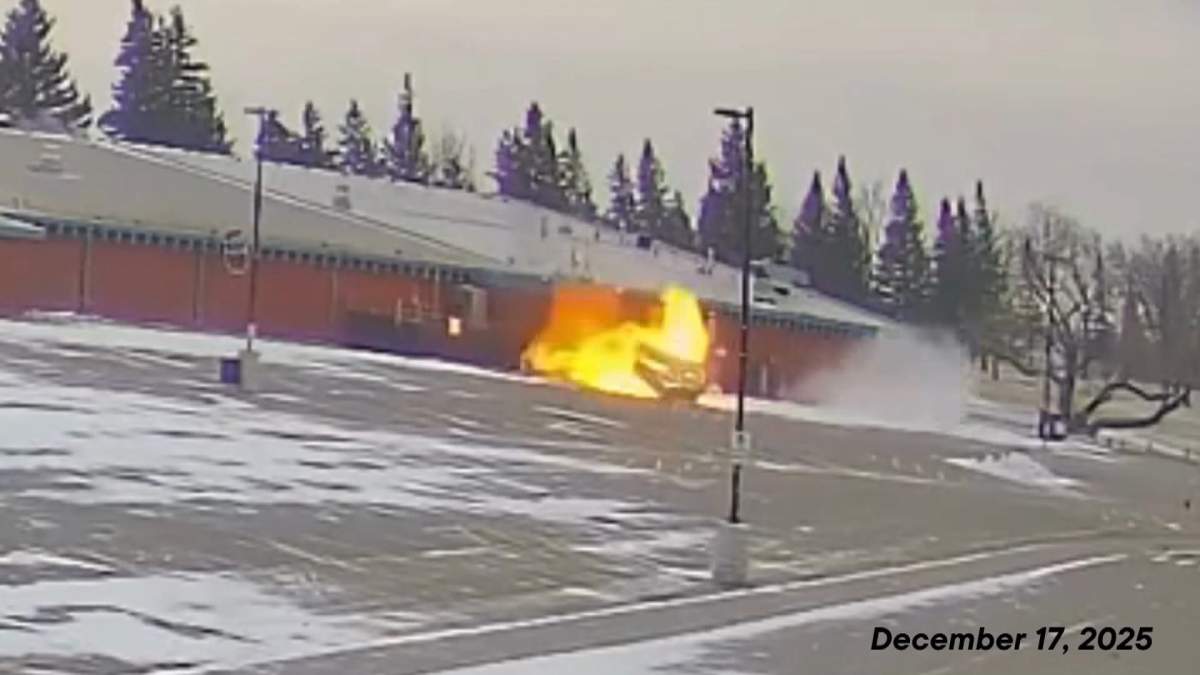 A photo, taken from video provided by the town of Taber, shows a wall of flame coming from a door in the community's centre, following the explosion on Dec. 17, 2025.