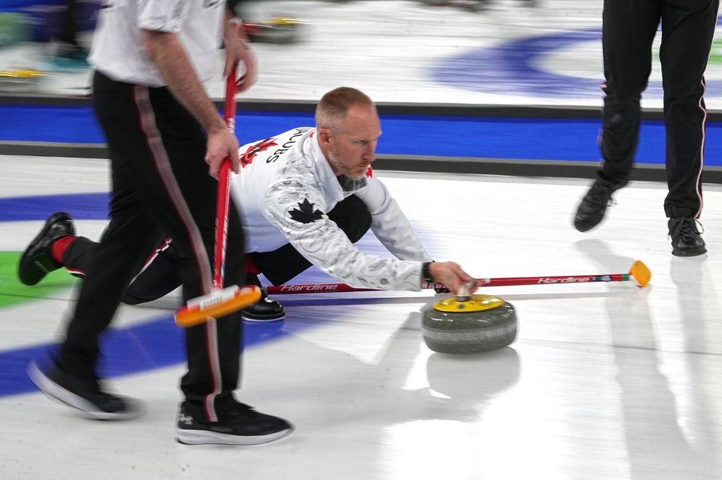 Canada's Brad Jacobs in action during the men's curling round robin session against Norway at the 2026 Winter Olympics, in Cortina d'Ampezzo, Italy, Thursday, Feb. 19, 2026. (AP Photo/Fatima Shbair).