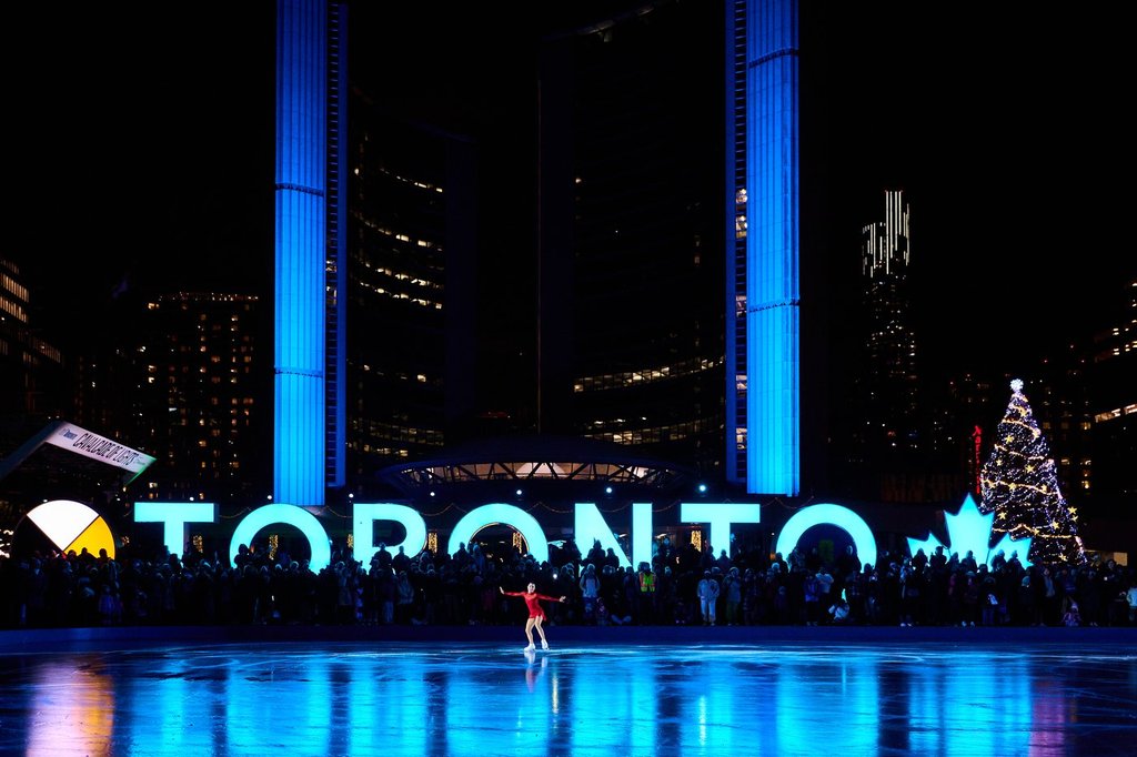 Olympian and three-time figure skating Canadian champion Madeline Schizas performs on the opening night of the annual Cavalcade of Lights at Nathan Phillips Square, in Toronto, on Saturday, Nov. 29, 2025. THE CANADIAN PRESS/Sammy Kogan.