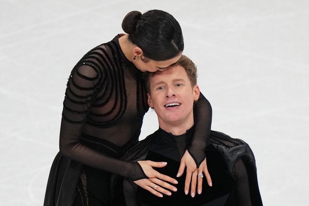 Madison Chock and Evan Bates of the United States compete during the figure skating ice dance team event at the 2026 Winter Olympics, in Milan, Italy, Saturday, Feb. 7, 2026. (AP Photo/Stephanie Scarbrough).