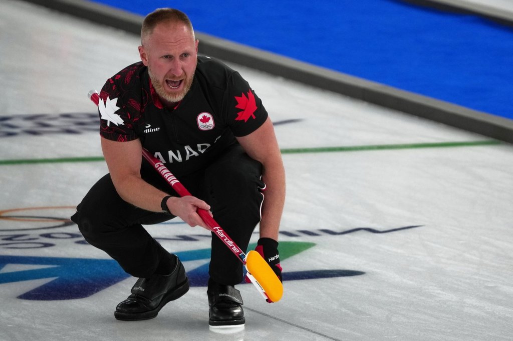 Canada's Brad Jacobs in action during the men's curling round robin session against Germany, at the 2026 Winter Olympics, in Cortina d'Ampezzo, Italy, Wednesday, Feb. 11, 2026. (AP Photo/Misper Apawu).
