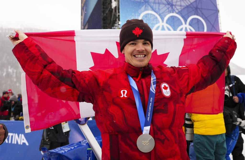 Mikael Kingsbury from Deux-Montagnes, Que., celebrates silver in the men's moguls at the Milano Cortina 2026 Winter Olympic Games in Livigno, Italy on Thursday, Feb. 12, 2026. THE CANADIAN PRESS/Sean Kilpatrick.