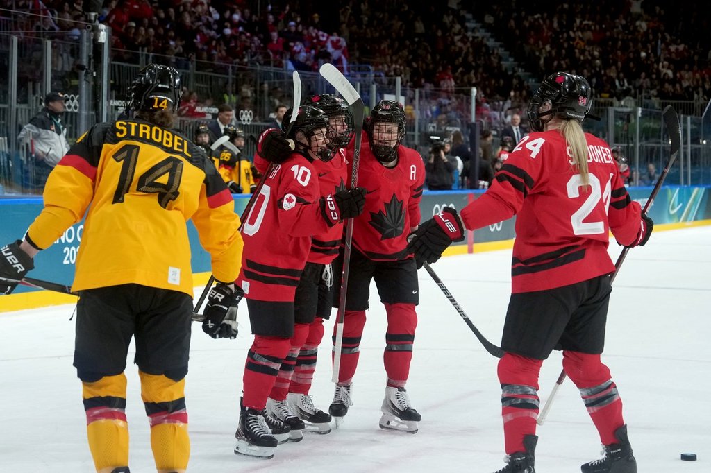 Canada's Marie-Philip Poulin (29) celebrates her goal with teammates during the third period of a women's hockey quarterfinal game against Germany at the 2026 Winter Olympics, in Milan, Saturday, Feb. 14, 2026. THE CANADIAN PRESS/Darryl Dyck.