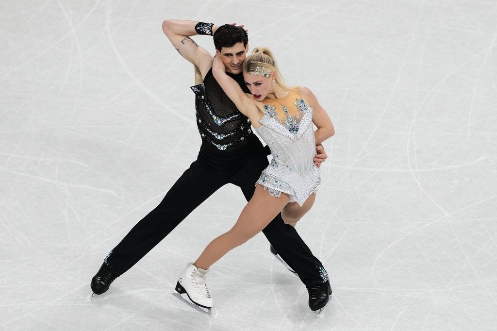 Piper Gilles and Paul Poirier of Canada compete during the rhythm dance in figure skating at the 2026 Winter Olympics, in Milan, Italy, Monday, Feb. 9, 2026. (AP Photo/Francisco Seco).