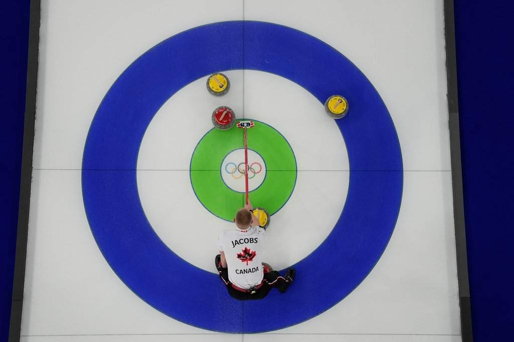 Canada's Brad Jacobs calls the line during a men's curling round-robin match against Czechia at the 2026 Winter Olympics in Cortina d'Ampezzo, Italy on Feb. 16, 2026. (AP Photo/David J. Phillip).