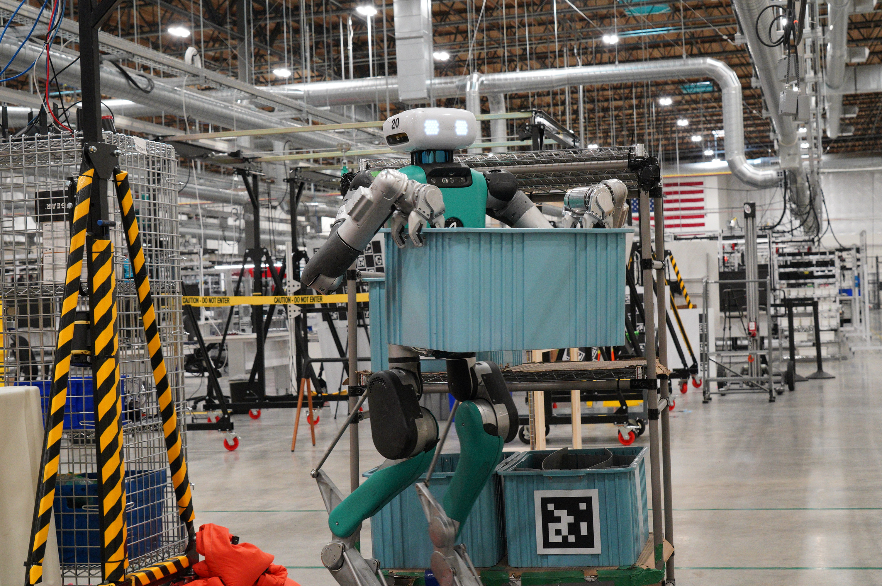Digit, a humanoid robot developed by Agility Robotics, performs material-handling tasks inside a manufacturing facility.				 
										
					 
					Agility Robotics
