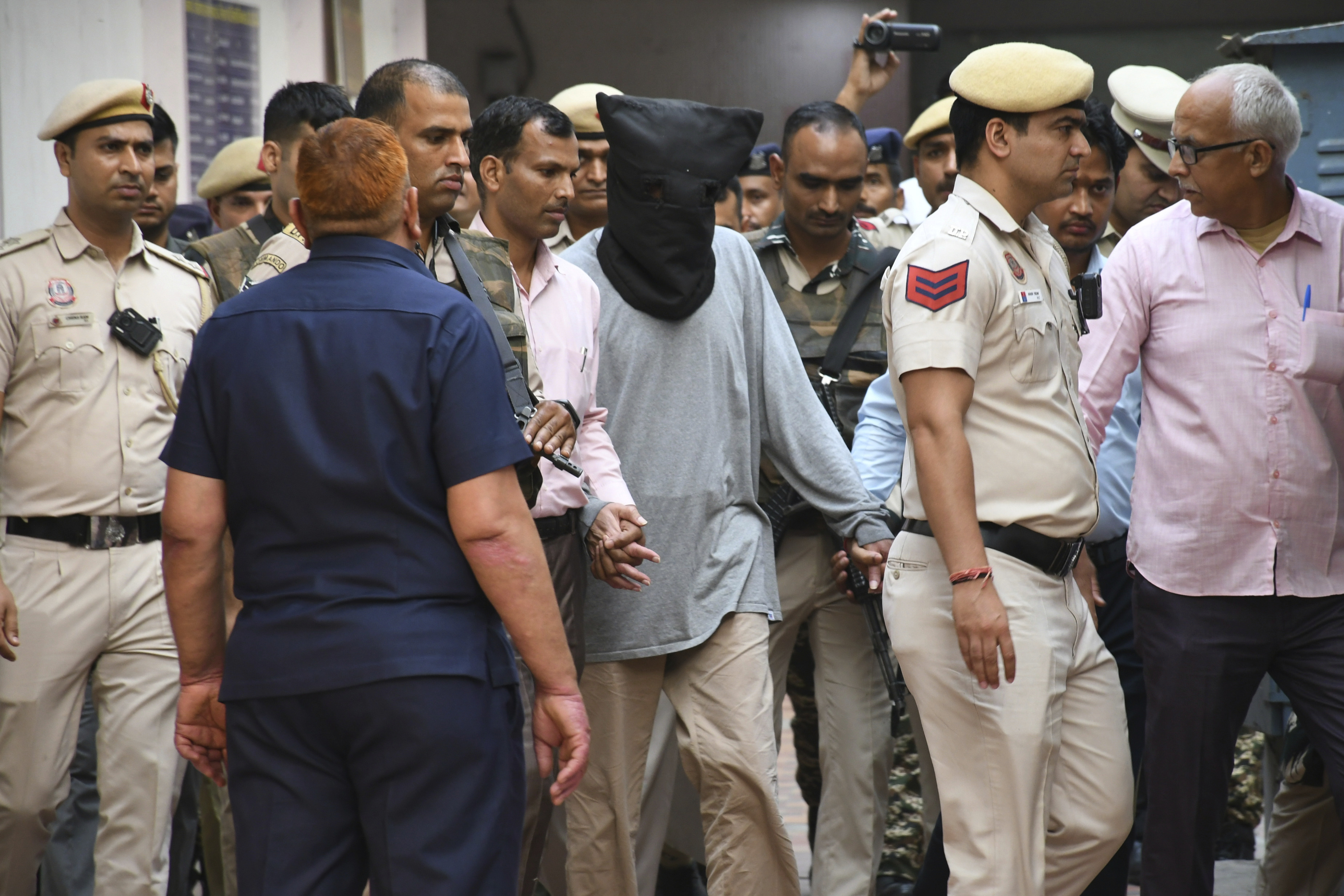 Tahawwur Rana is escorted to court in New Delhi, India, April 28, 2025. (AP Photo/Dinesh Joshi).