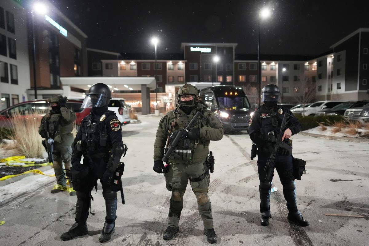 ICE immigration officers standing at a protest