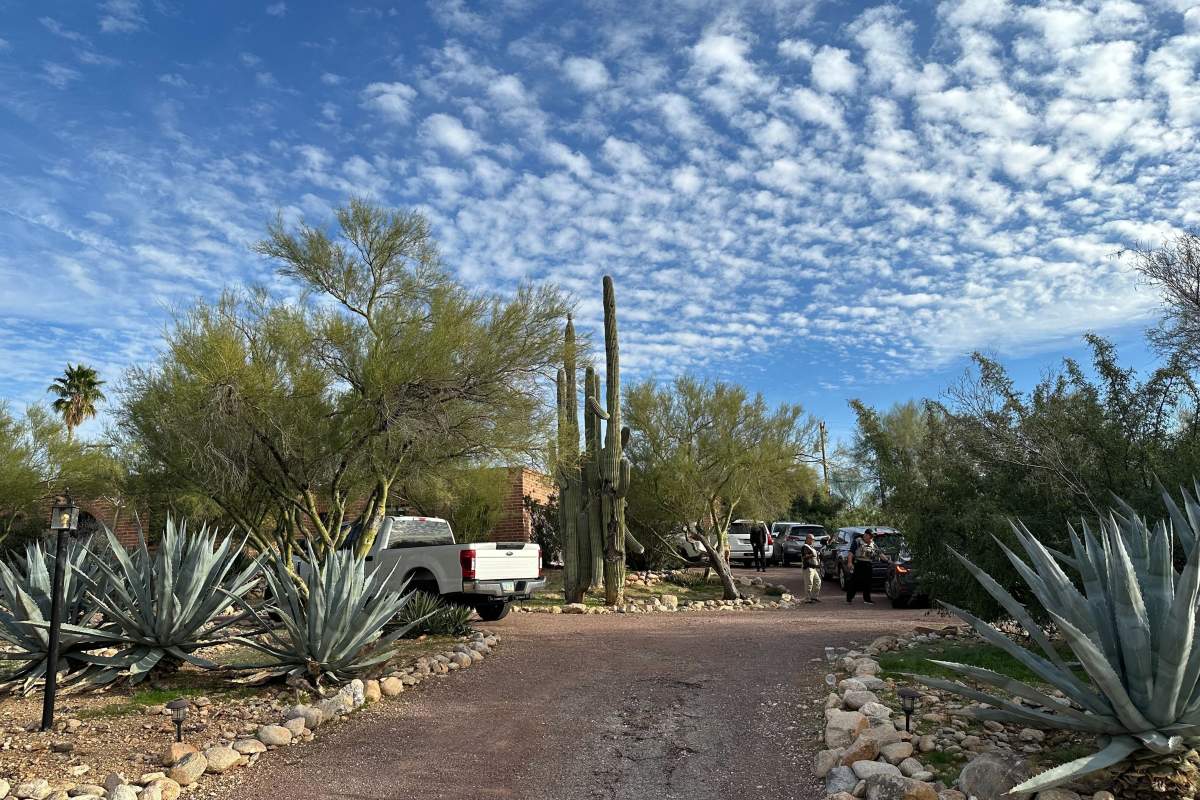 Law enforcement officers are present outside the home of Nancy Guthrie, the mother of 'Today' host Savannah Guthrie, near Tucson, Ariz., Monday, Feb. 2, 2026.