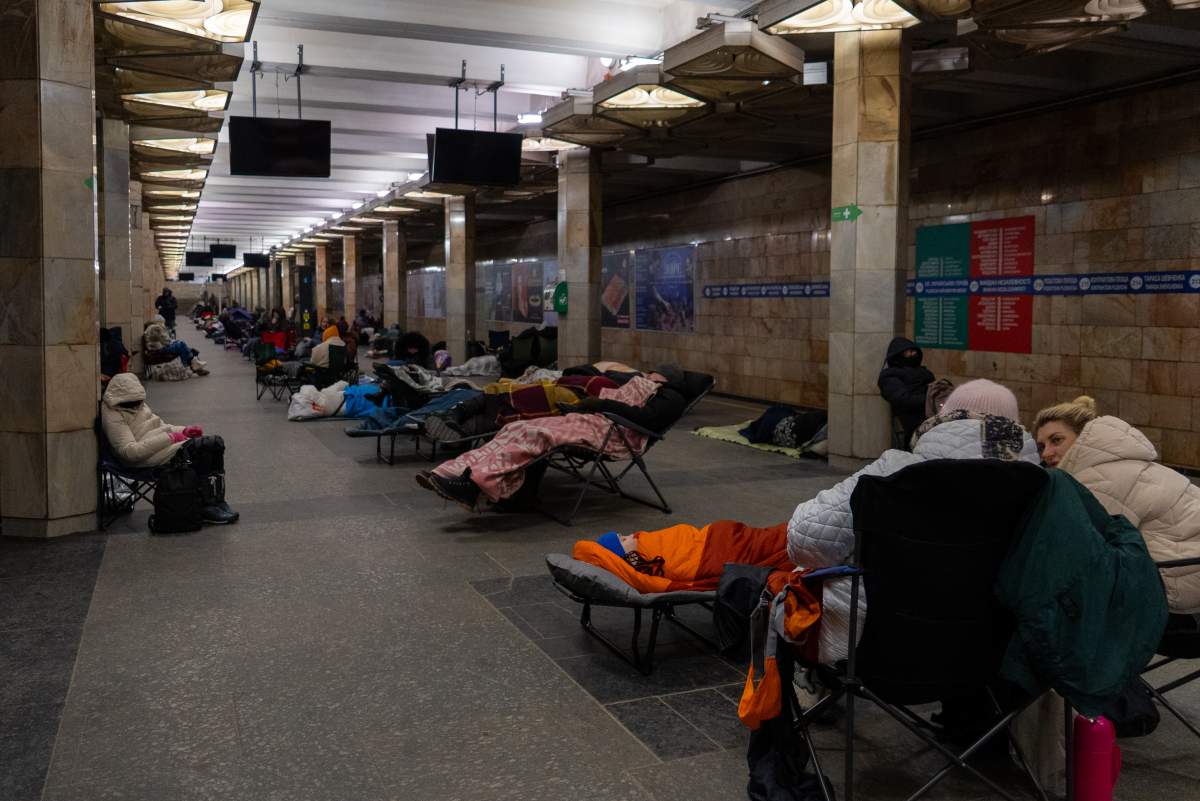 People take shelter in a metro station, being used as a bomb shelter, during a Russian drones attack in Kyiv, Ukraine, Tuesday, Feb. 3, 2026. (AP Photo/Alex Babenko).
