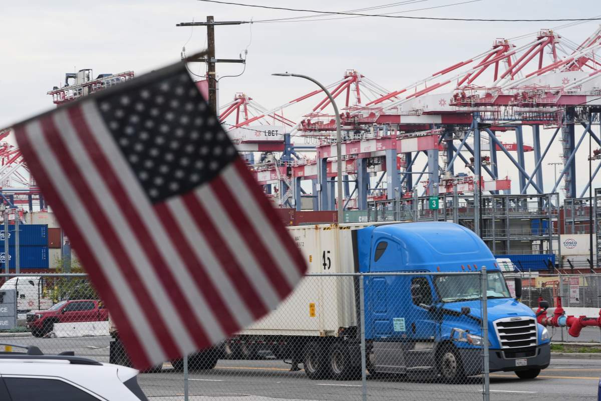 A U.S. flag files at the Port of Long Beach Friday, Feb. 20, 2026, in Long Beach, Calif.