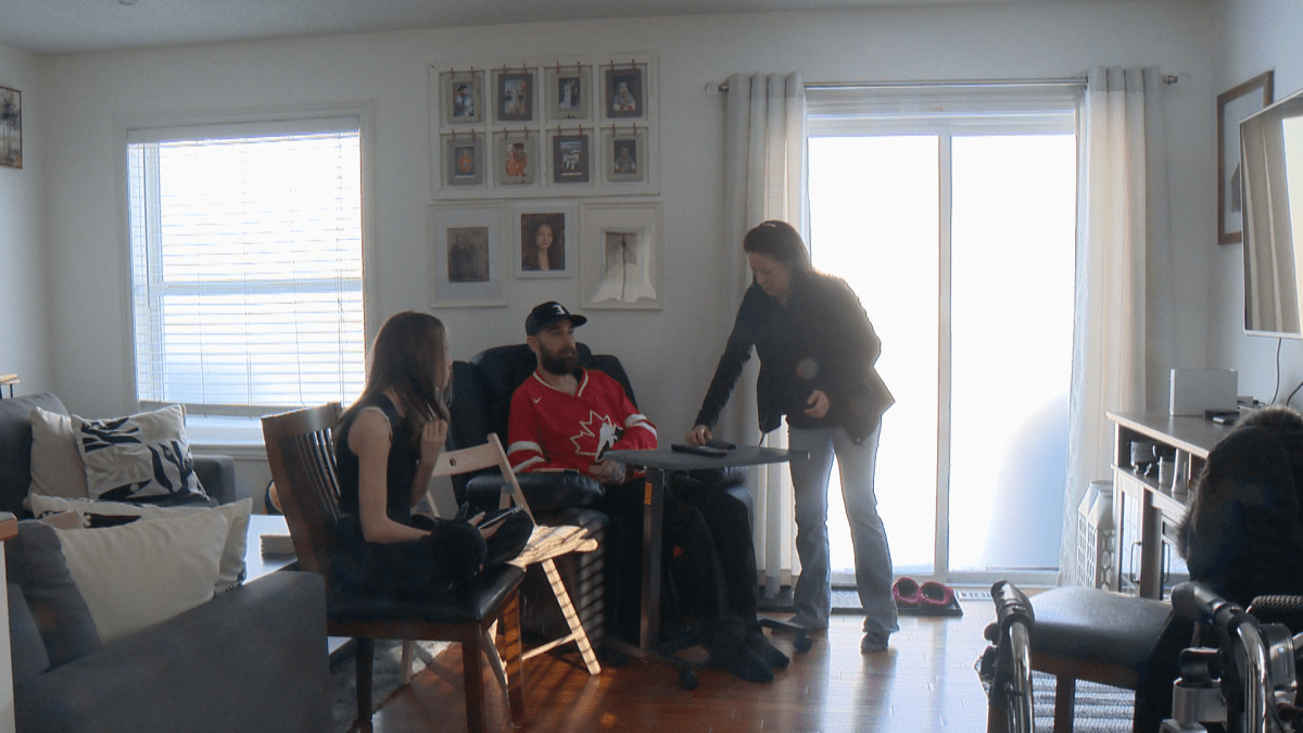Calgary family talks in their living room.