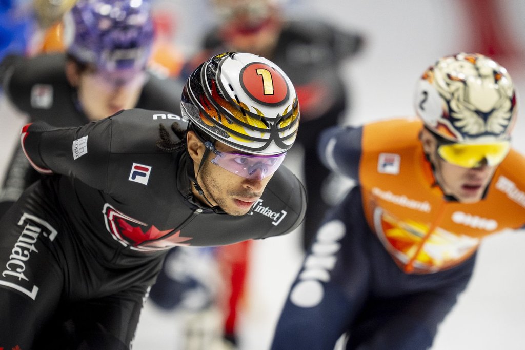 William Dandjinou of Canada skates in the pack during the 1500m race at the ISU Short Track World Tour speedskating event in Montreal on Saturday, Oct. 18, 2025. THE CANADIAN PRESS/Christopher Katsarov.