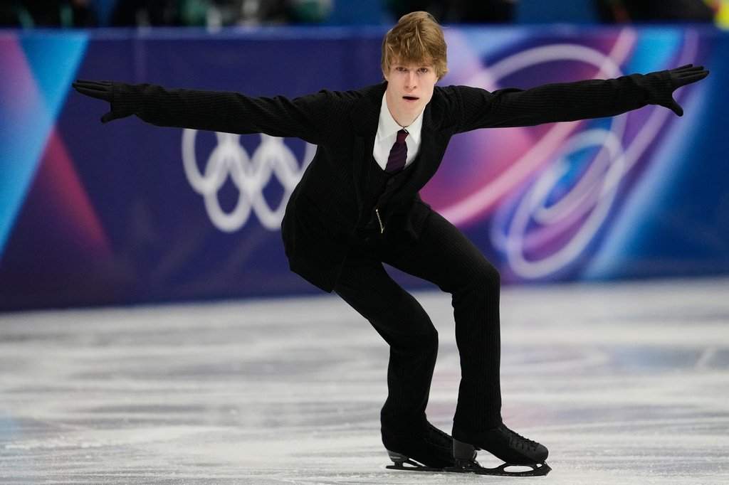 Stephen Gogolev of Canada competes during the men's figure skating short program at the 2026 Winter Olympics, in Milan, Italy, Tuesday, Feb. 10, 2026. (AP Photo/Ashley Landis).