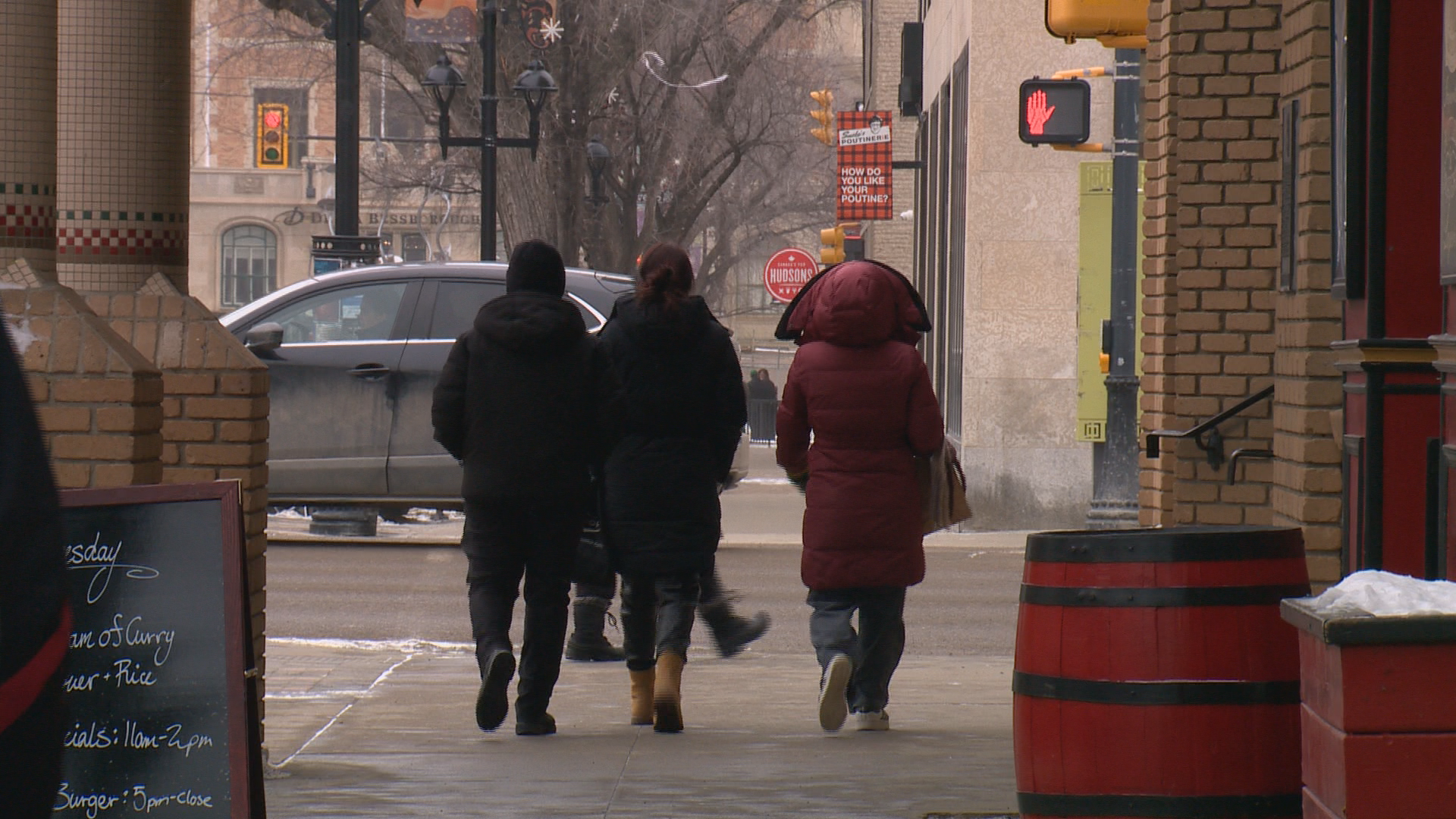 People walk on street in Saskatoon