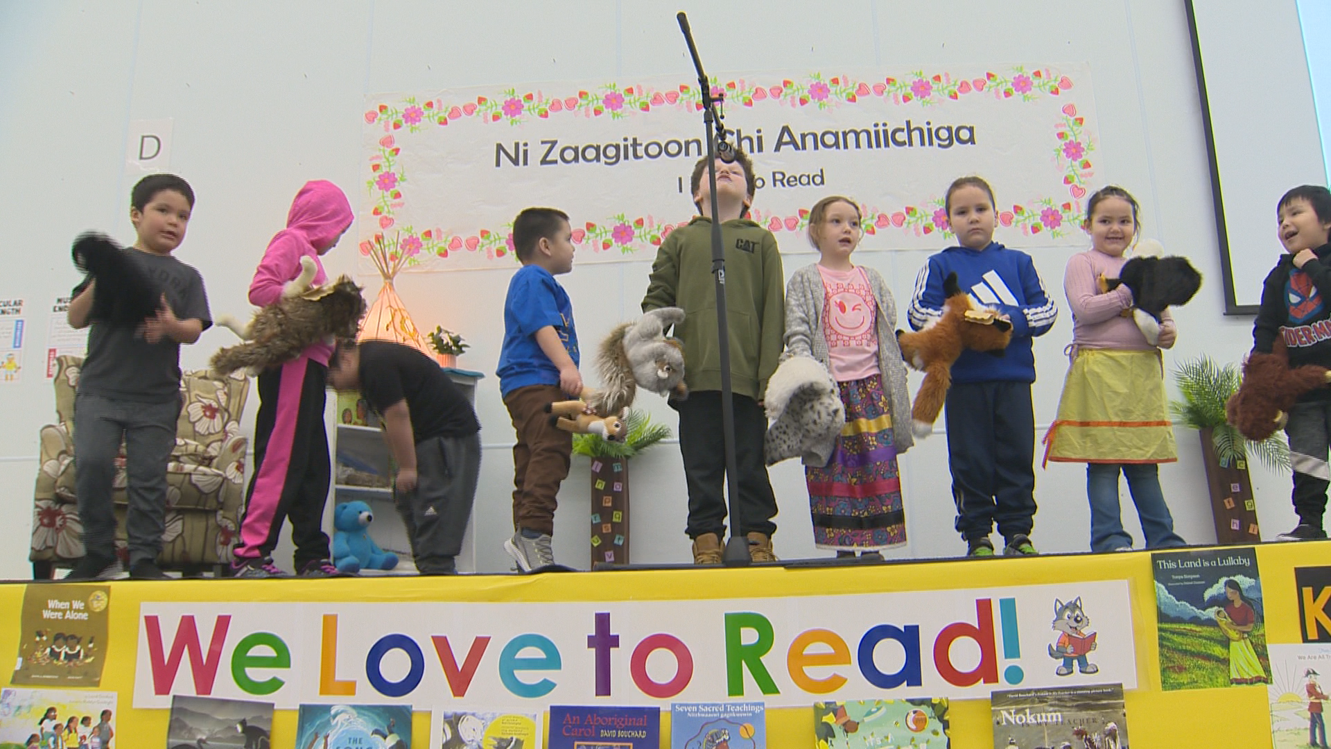 Students at Sergeant Tommy Prince School give a presentation at the "I Love to Read" month celebration on Monday. The school is also celebrating a marked improvement in literacy rates.