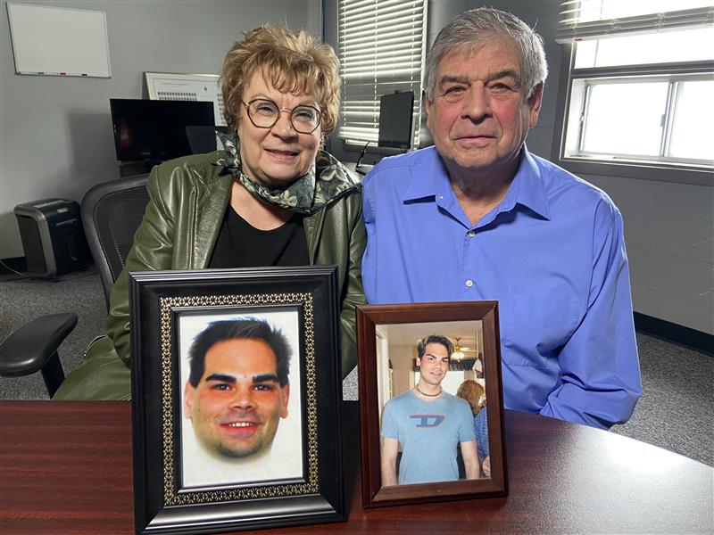 Dianne and Mike Ilesic, with pictures of their son Brian, want to pass a bill to prevent multiple parole hearings for murderers.