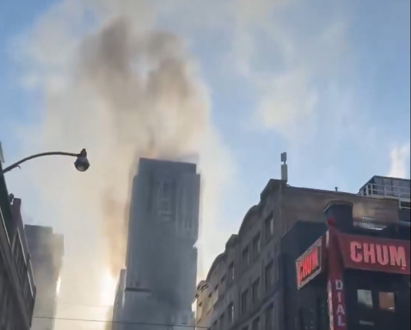 Explosions from building rooftop fire shut down streets in downtown Toronto
