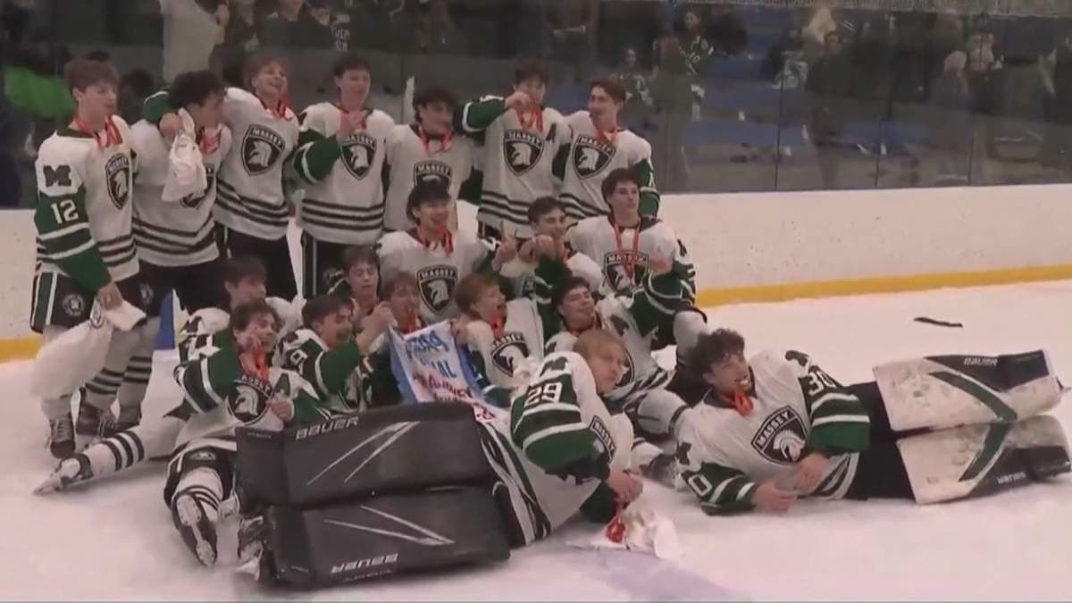 The Vincent Massey Trojans celebrate their boys provincial championship in high school hockey.