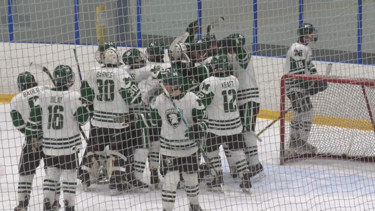 The Vincent Massey Trojans celebrate a Game 1 win over Oak Park in the WHSHL final.