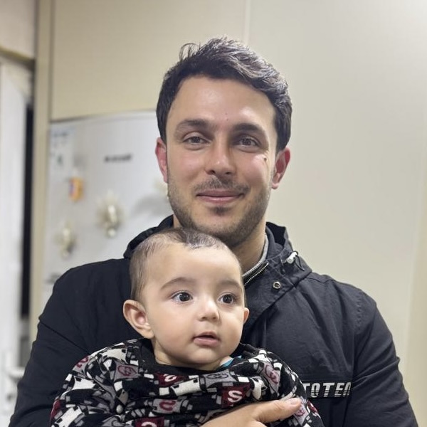 Walat Tahir, holding his son, was killed in a Saturday drone strike, Erbil, Iraq, March 9, 2026.				 
										
					 
					Family handout