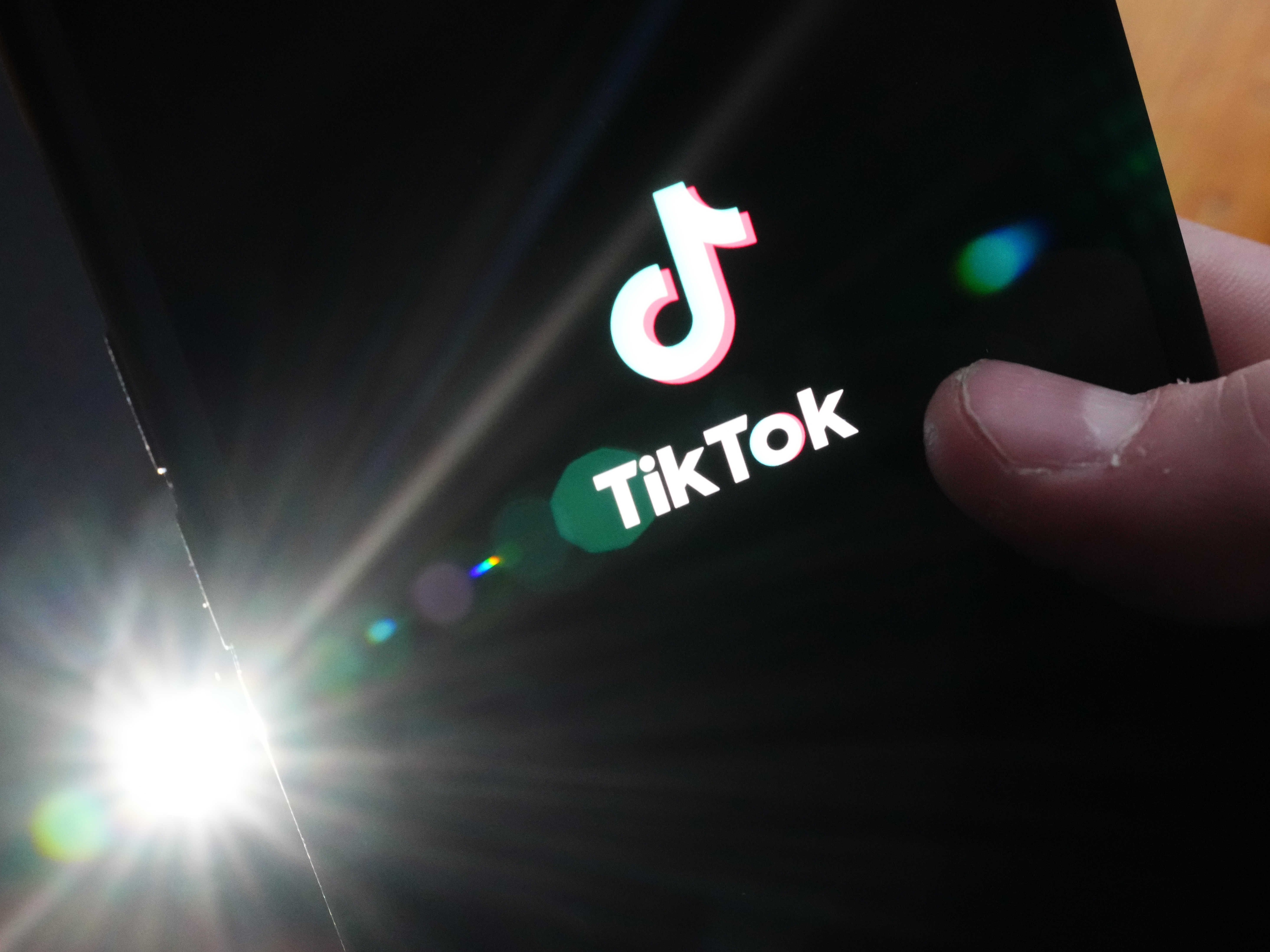 TikTok logo on a black screen