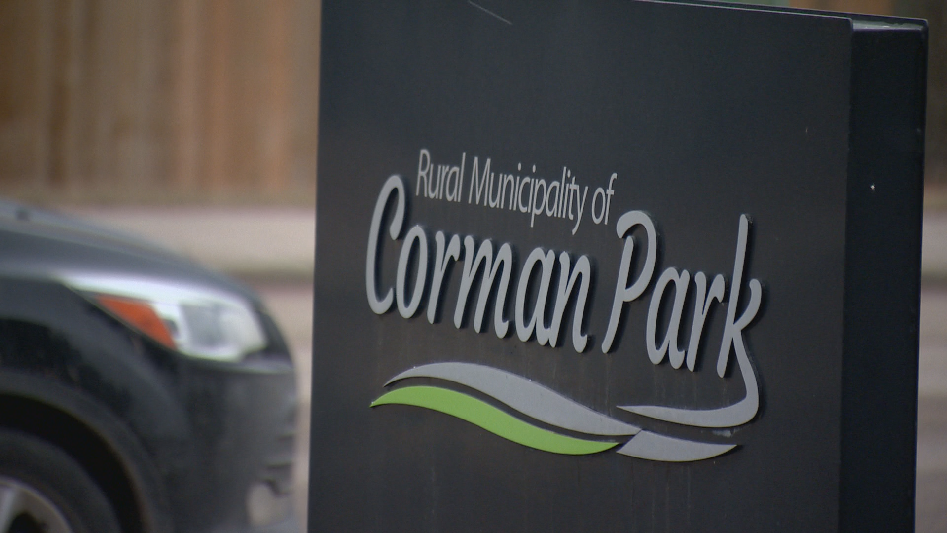 A black sign with lettering reads Rural Municipality of Corman Park
