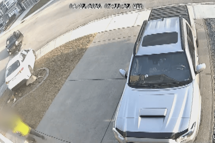 Father, son nearly hit by vehicle outside Calgary home after driver runs stop sign: police