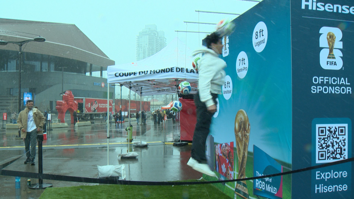 A fan hits a soccer ball with their head
