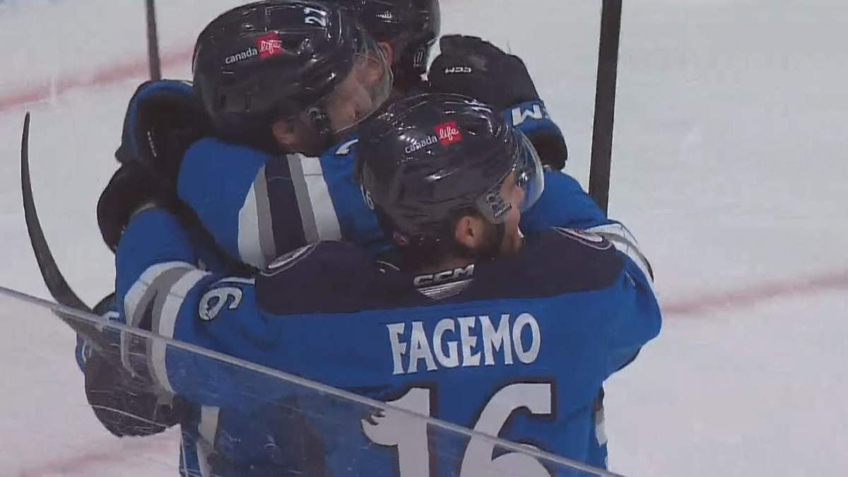 The Manitoba Moose celebrate a last-minute go-ahead goal in a Game 2 win over Milwaukee.