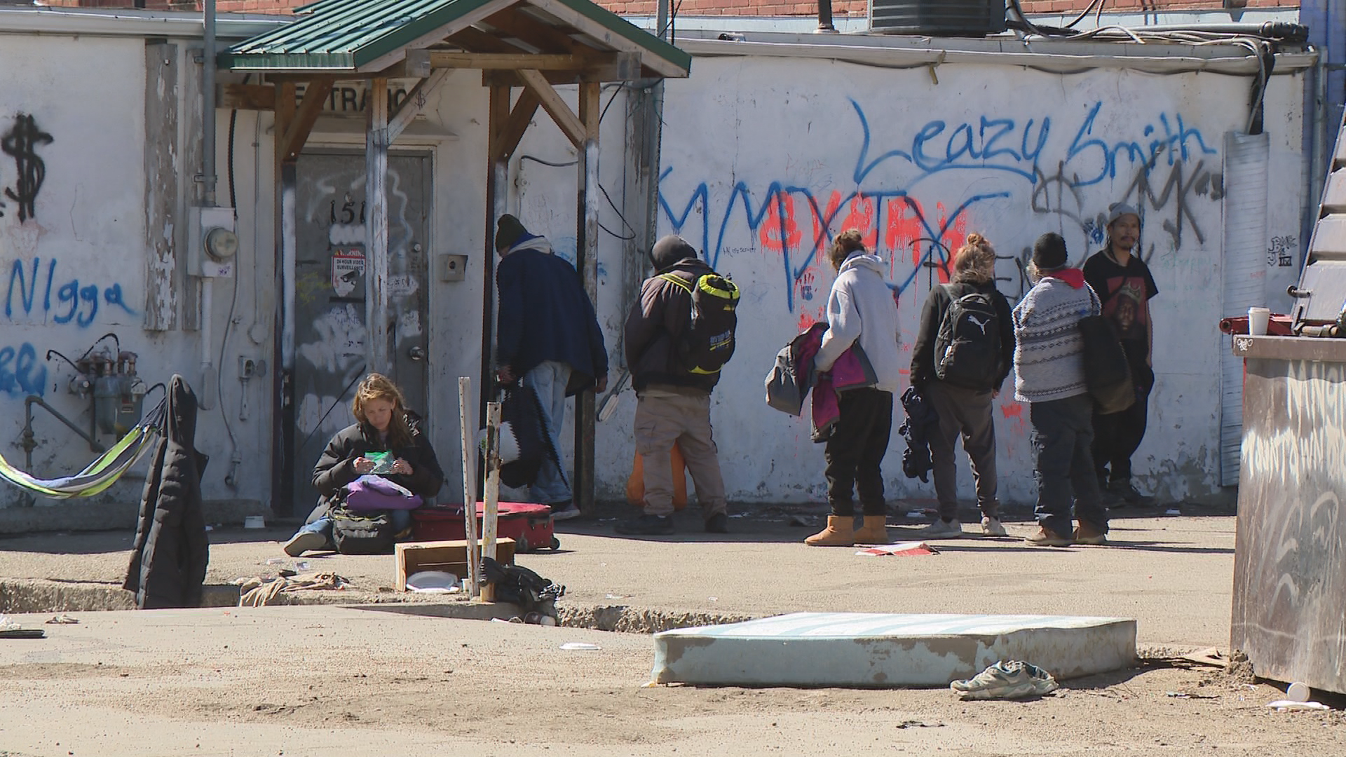 People line up outside of Prairie Harm Reduction.