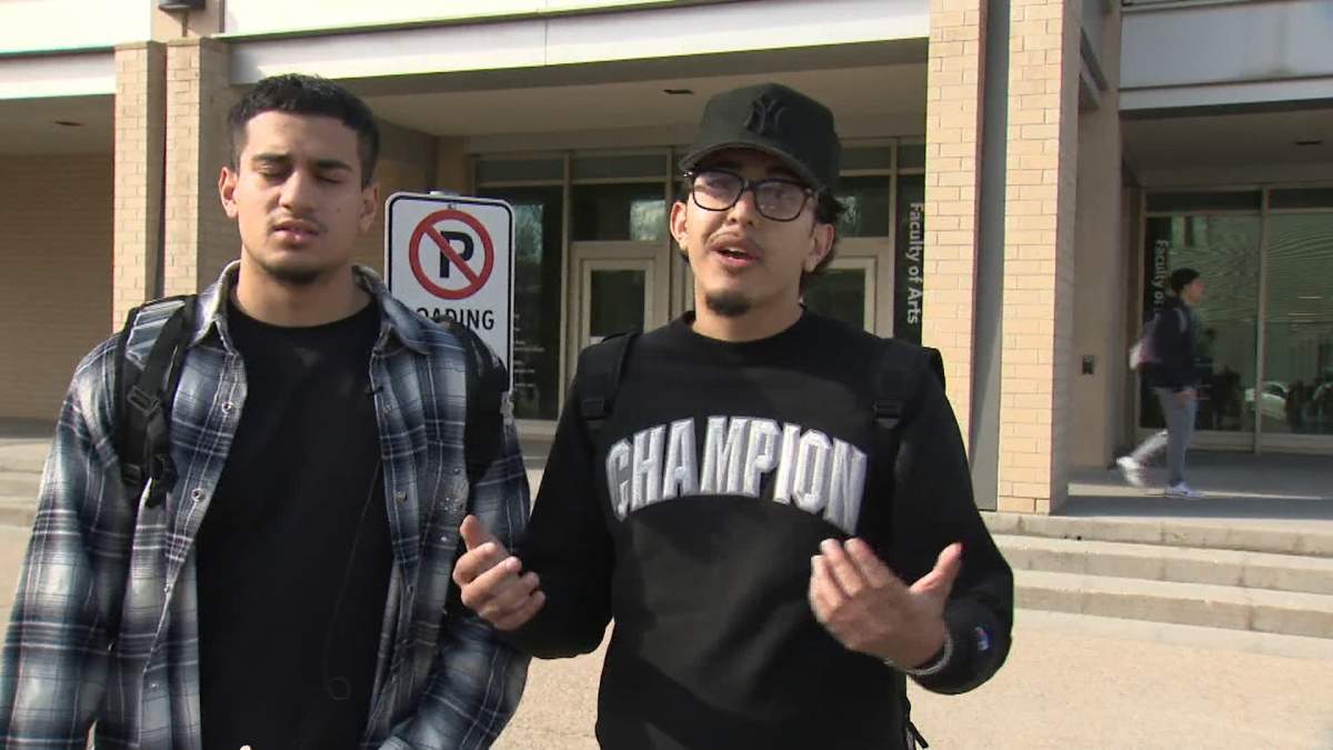 MRU student Ahmer Khan (right) said he saw a bunch of cops with big guns but couldn't get any answers about what was going on.