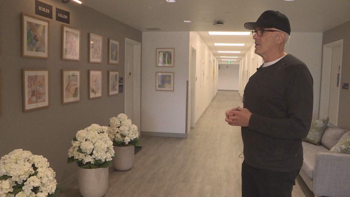 Scott Oake stands in the Buhler Gallery at the Bruce Oake Recovery Centre.